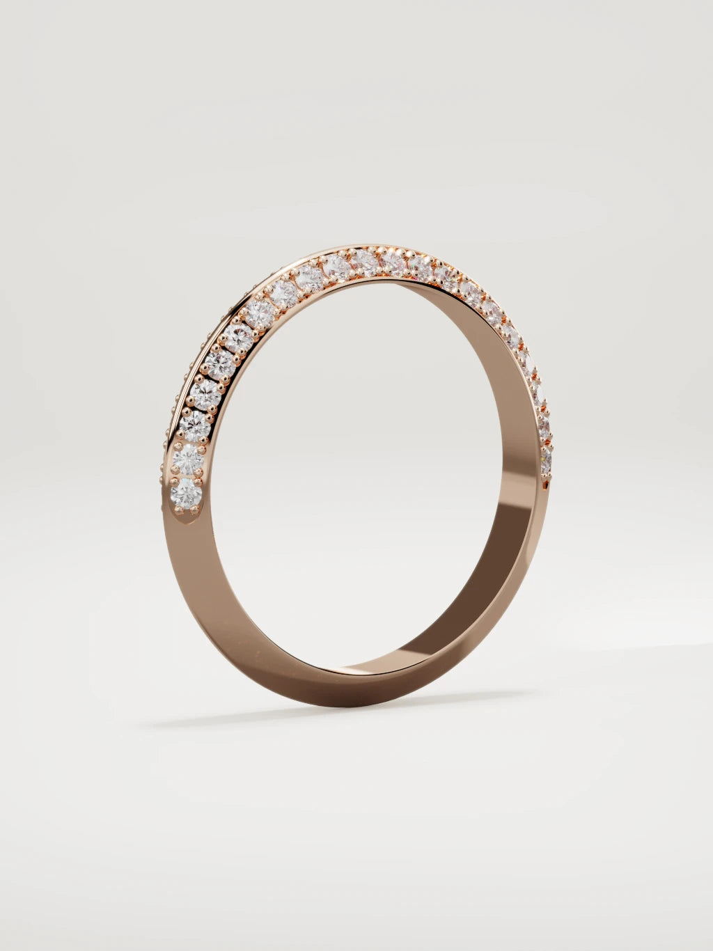 The Rayo diamond knife-edge men's band in 14K rose gold, 3 mm, standing three-quarter view