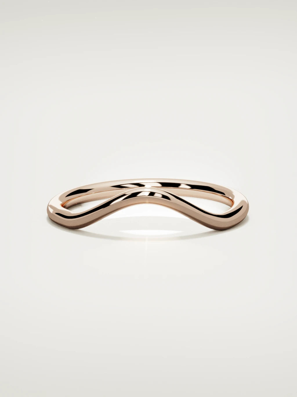 The Rima rounded contour wedding band in 14K rose gold, front view