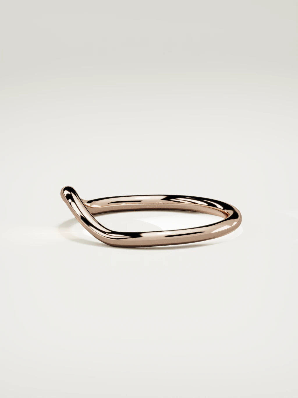 The Rima rounded contour wedding band in 14K rose gold, side view