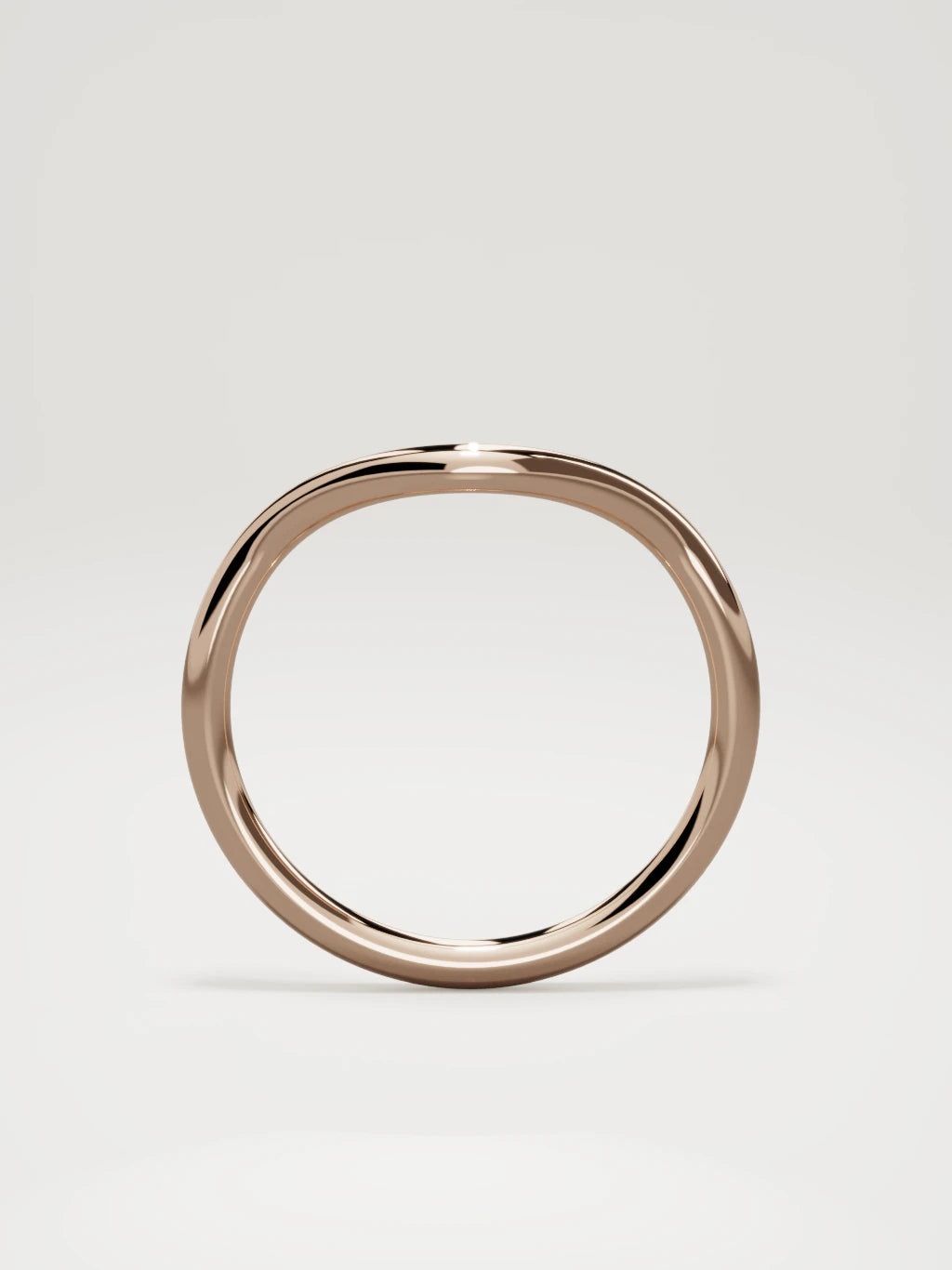 The Rima rounded contour wedding band in 14K rose gold, standing front view