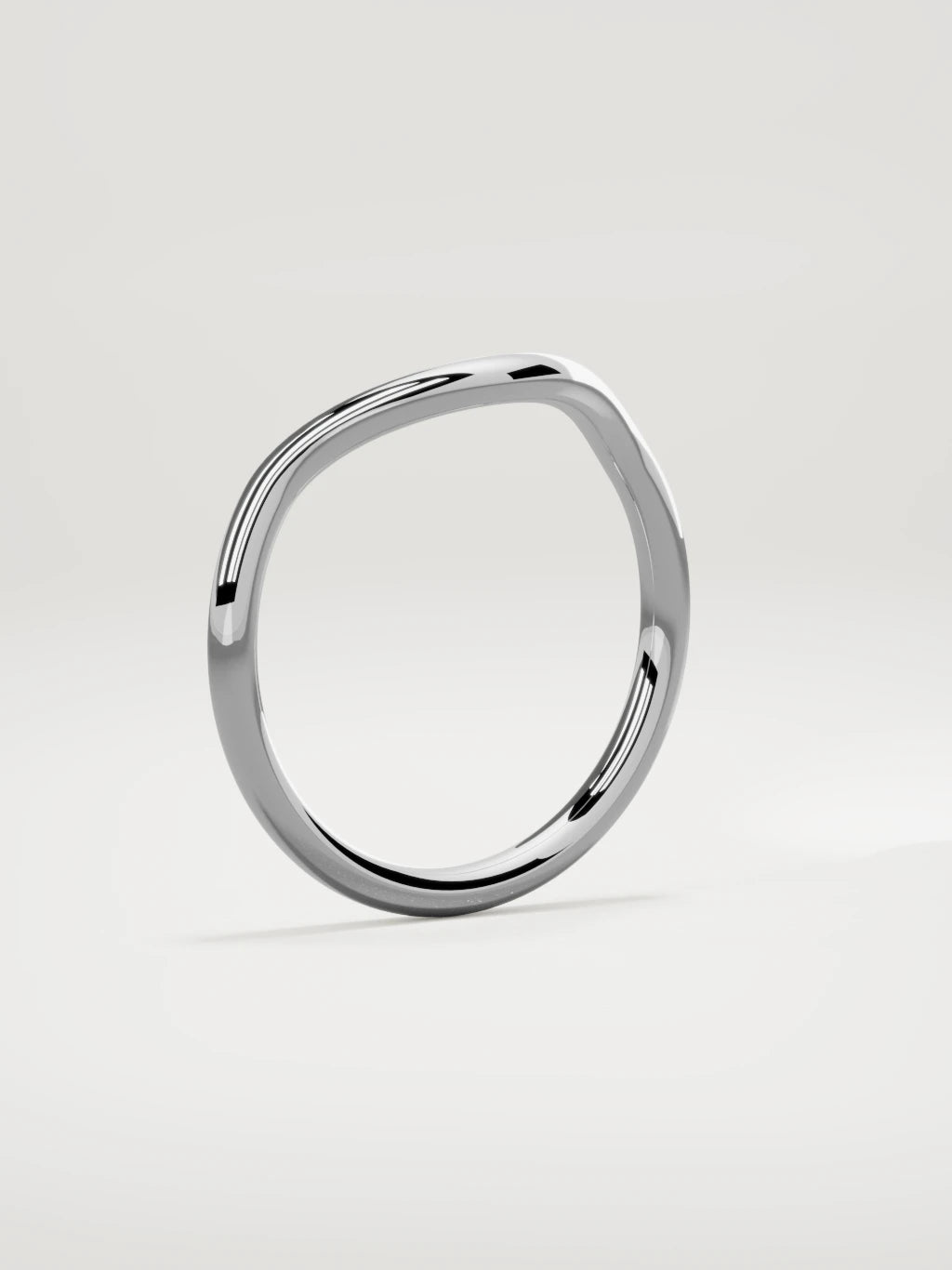 The Rima rounded contour wedding band in 14K white gold, standing three-quarter view