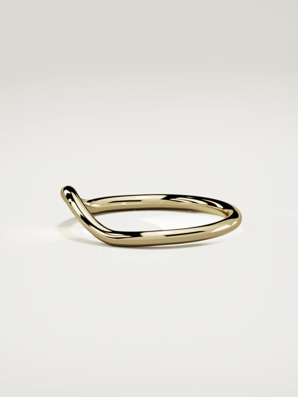 The Rima rounded contour wedding band in 14K yellow gold, side view