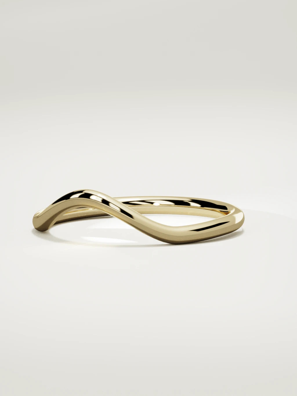 The Rima rounded contour wedding band in 14K yellow gold, three-quarter view
