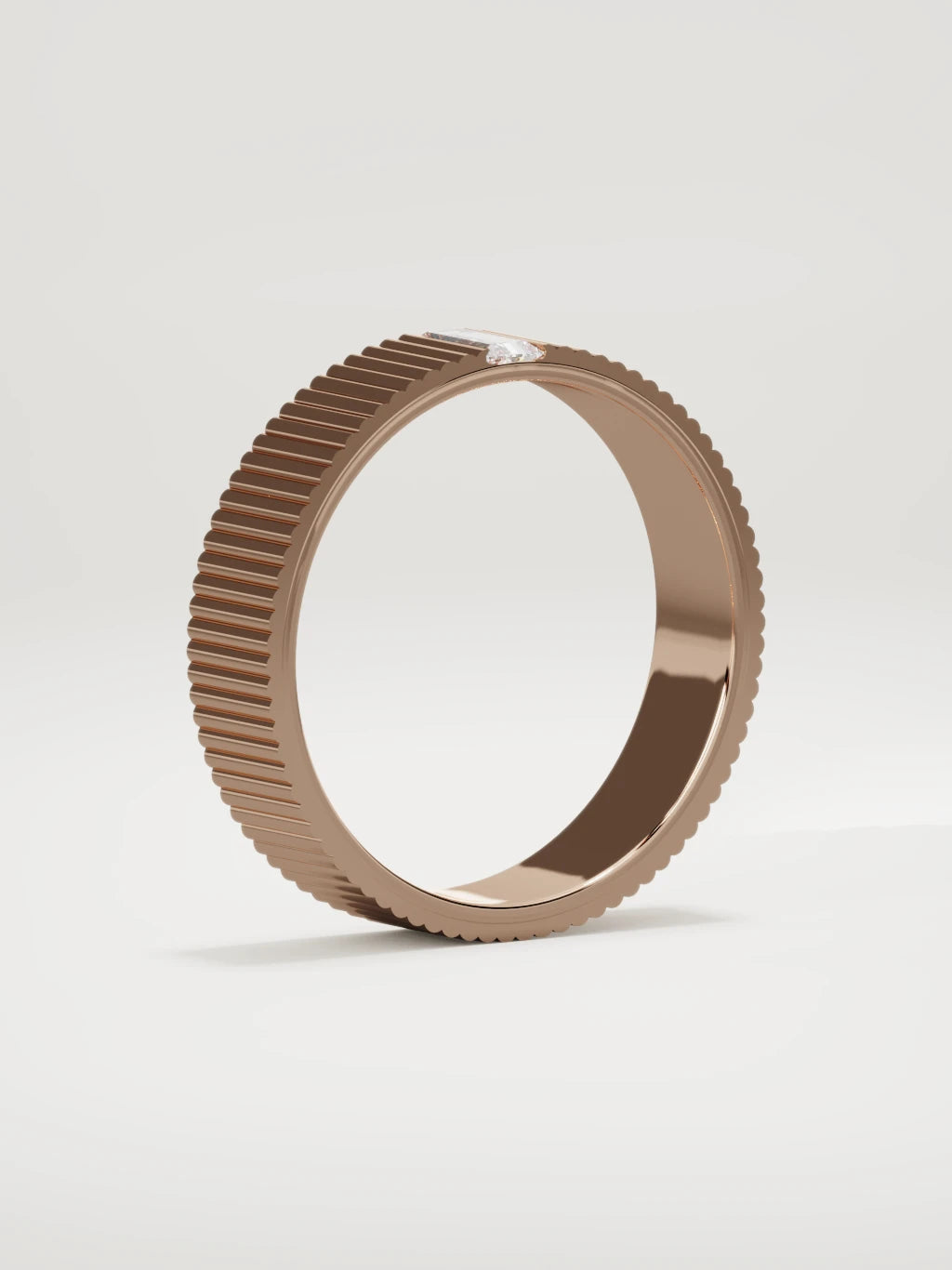 The Ritmo fluted baguette men's wedding band in 14K rose gold, 5 mm, standing three-quarter view