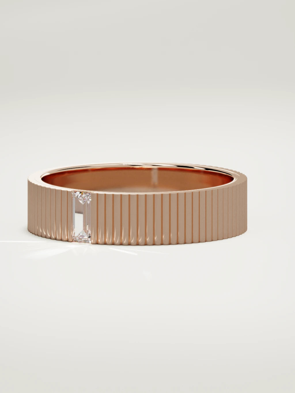 The Ritmo fluted baguette men's wedding band in 14K rose gold, 5 mm, three-quarter view