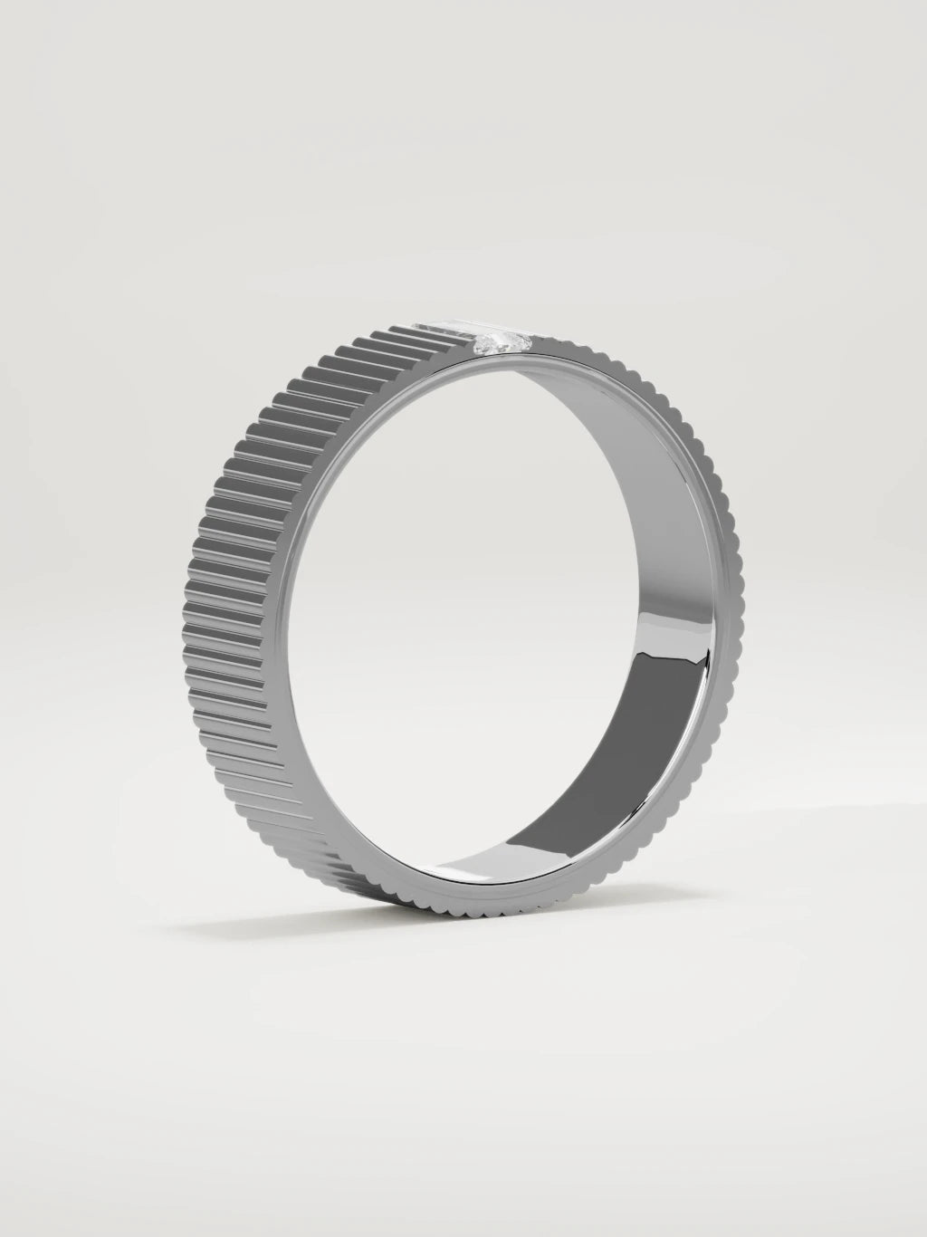 The Ritmo fluted baguette men's wedding band in 14K white gold, 5 mm, standing three-quarter view