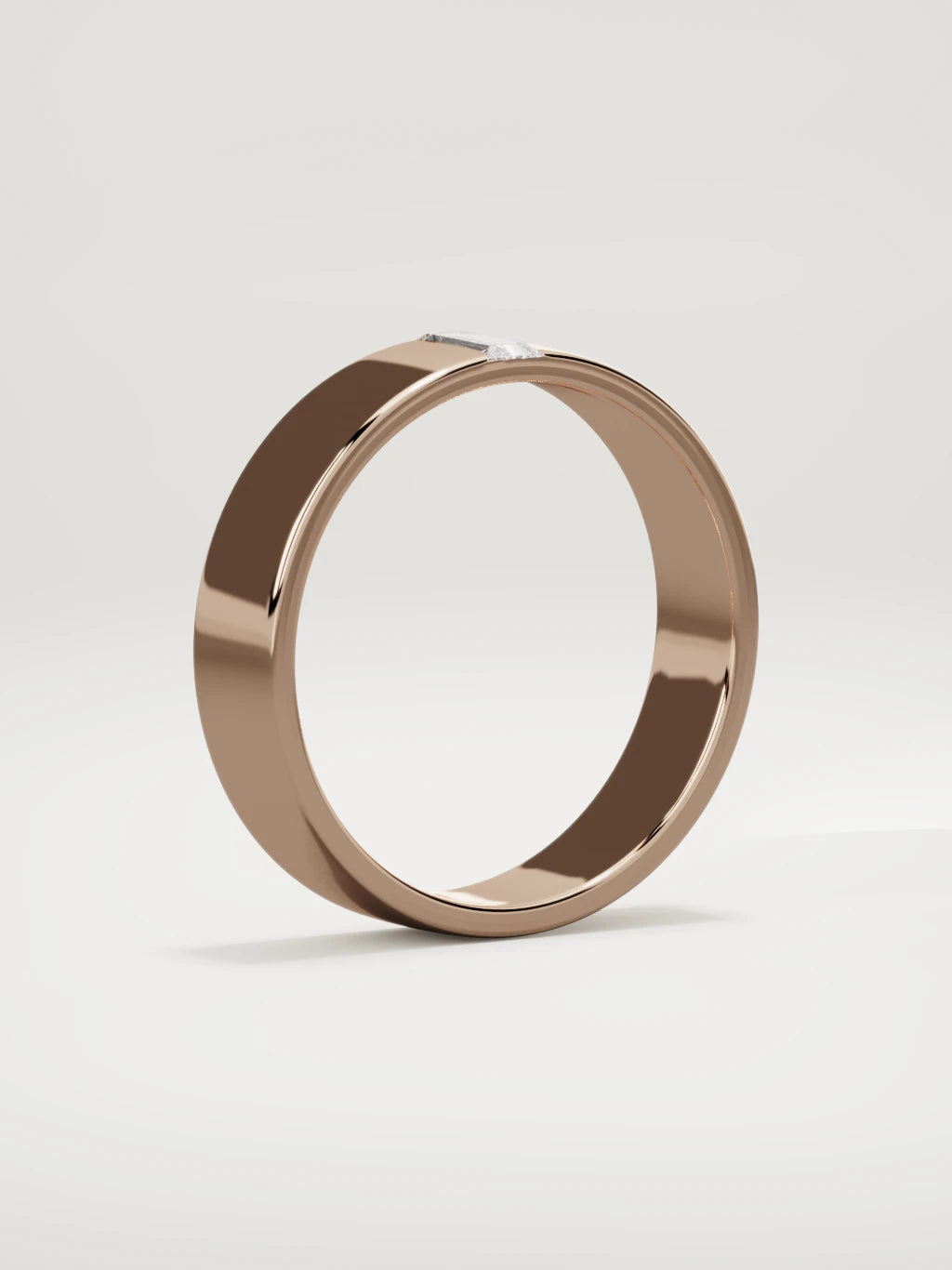 The Solo flat baguette men's wedding band in 14K rose gold, 5 mm, standing three-quarter view