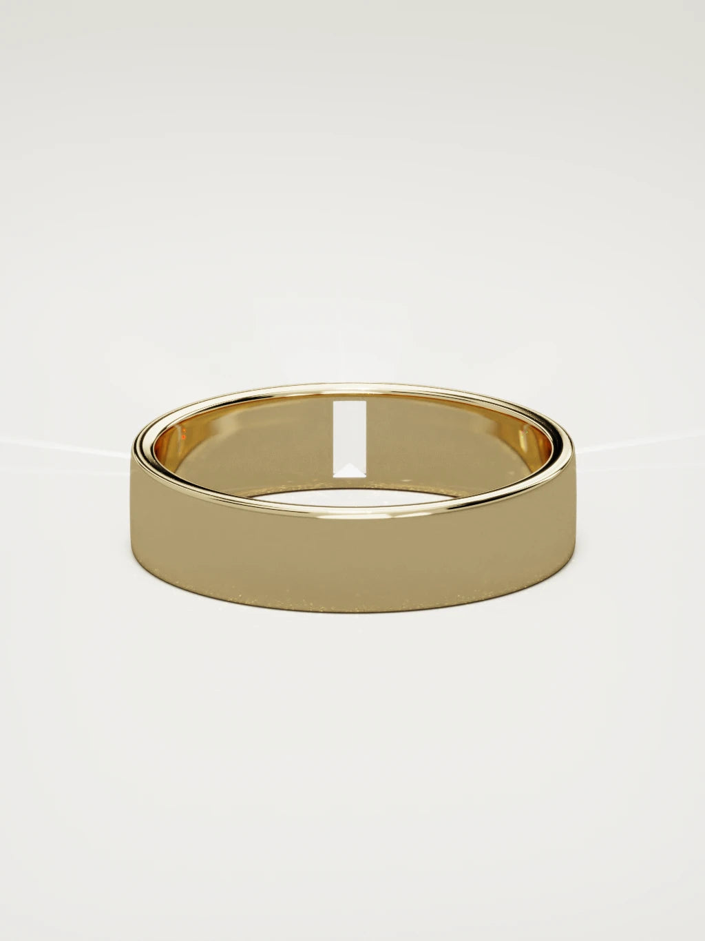 The Solo flat baguette men's wedding band in 14K yellow gold, 5 mm, back view