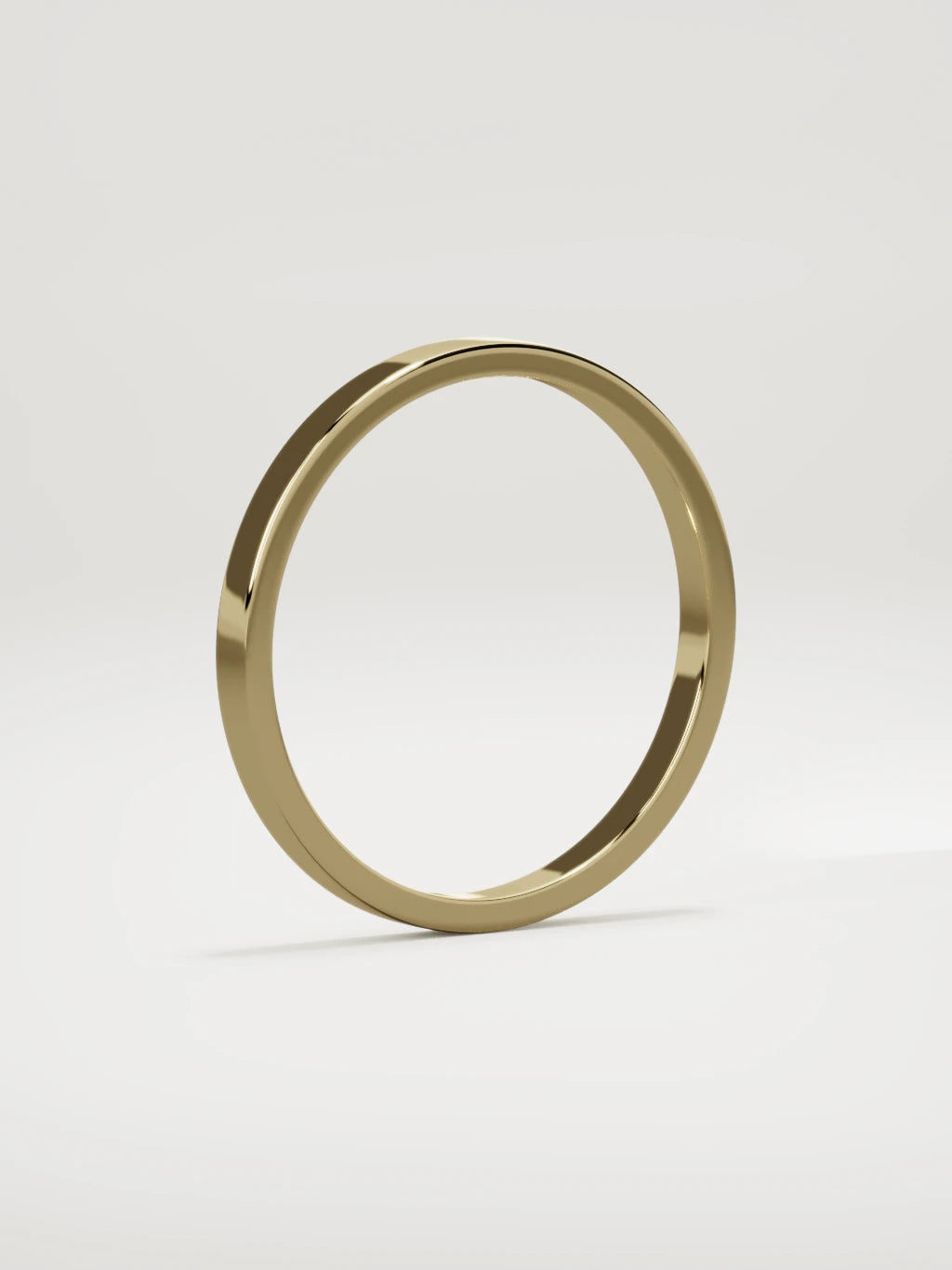 The Noble flat men's wedding band in 14K yellow gold, 2 mm, standing three-quarter view
