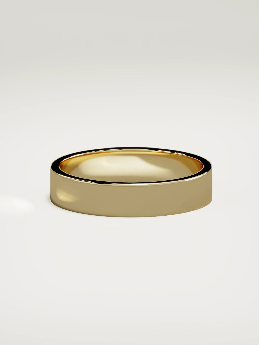 The Noble flat men's wedding band in 14K yellow gold, 5 mm, side view