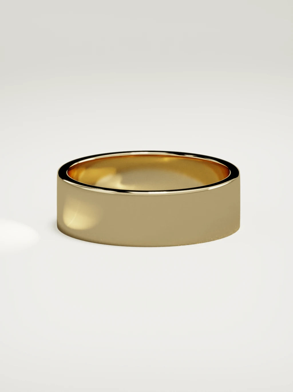 The Noble flat men's wedding band in 14K yellow gold, 7 mm, side view