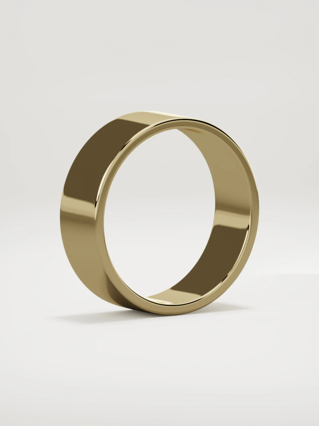 The Noble flat men's wedding band in 14K yellow gold, 7 mm, standing three-quarter view