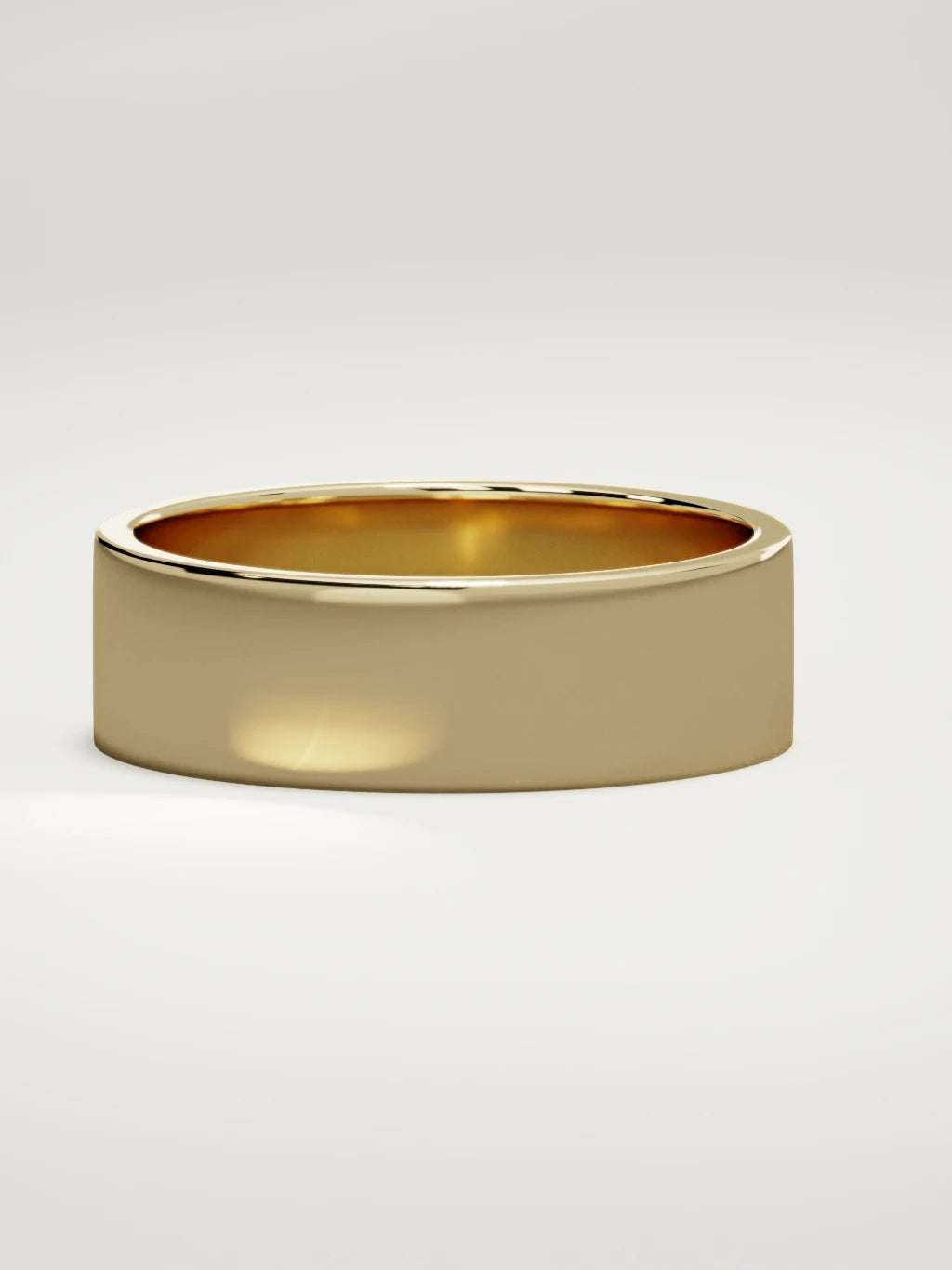 The Noble flat men's wedding band in 14K yellow gold, 7 mm, three-quarter view