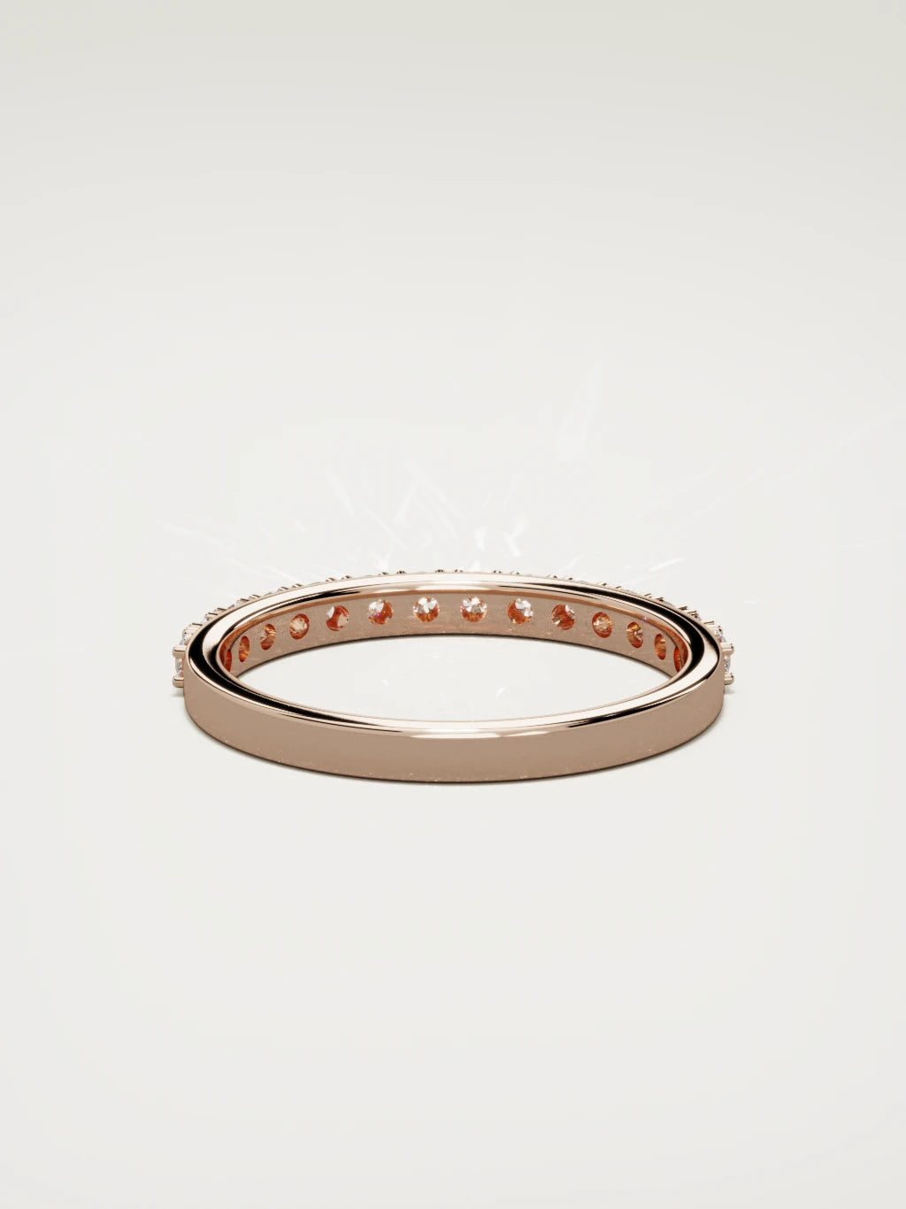 The Sutil low-profile petite half eternity band in 14K rose gold, back view
