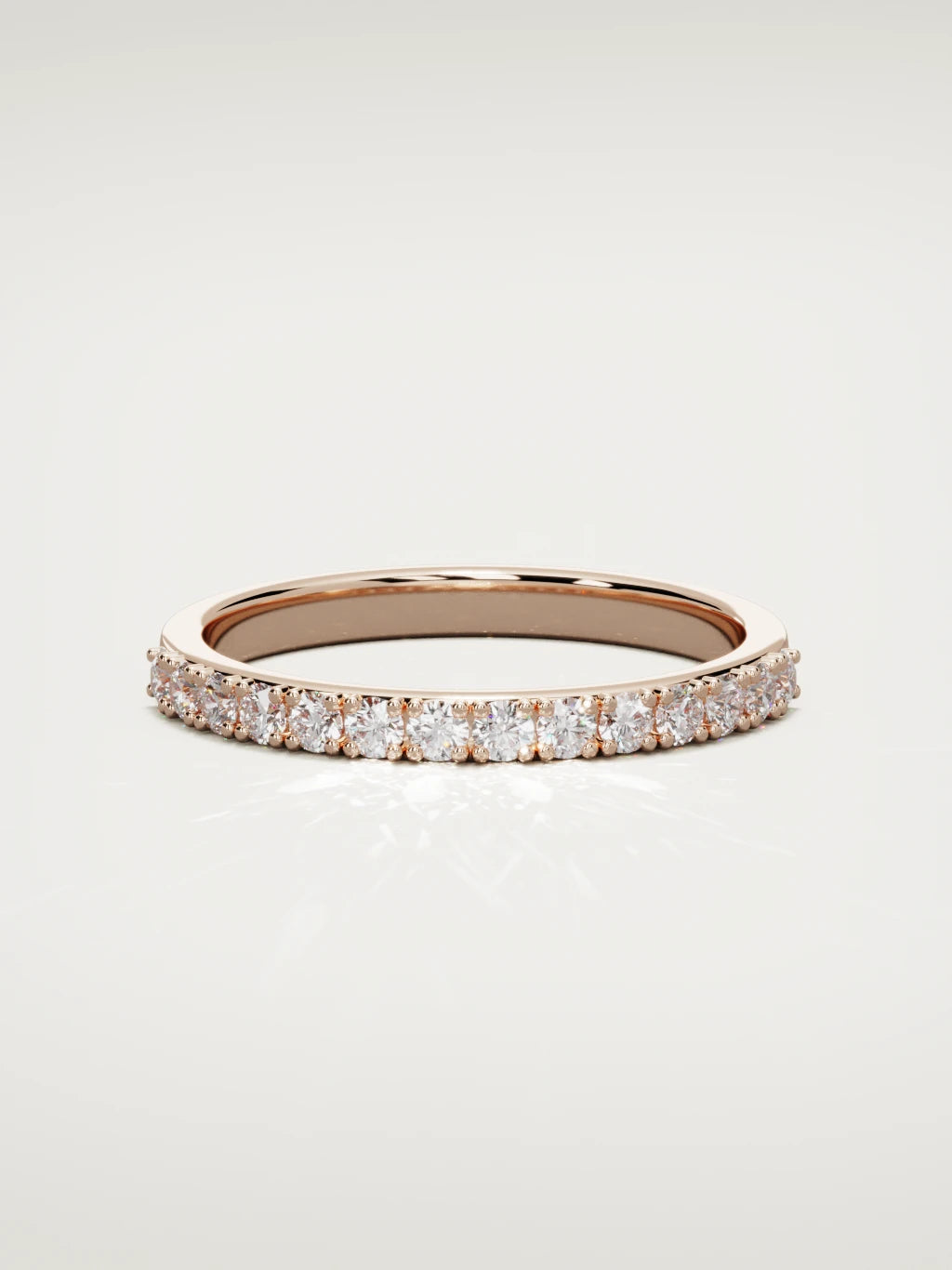 The Sutil low-profile petite half eternity band in 14K rose gold, front view
