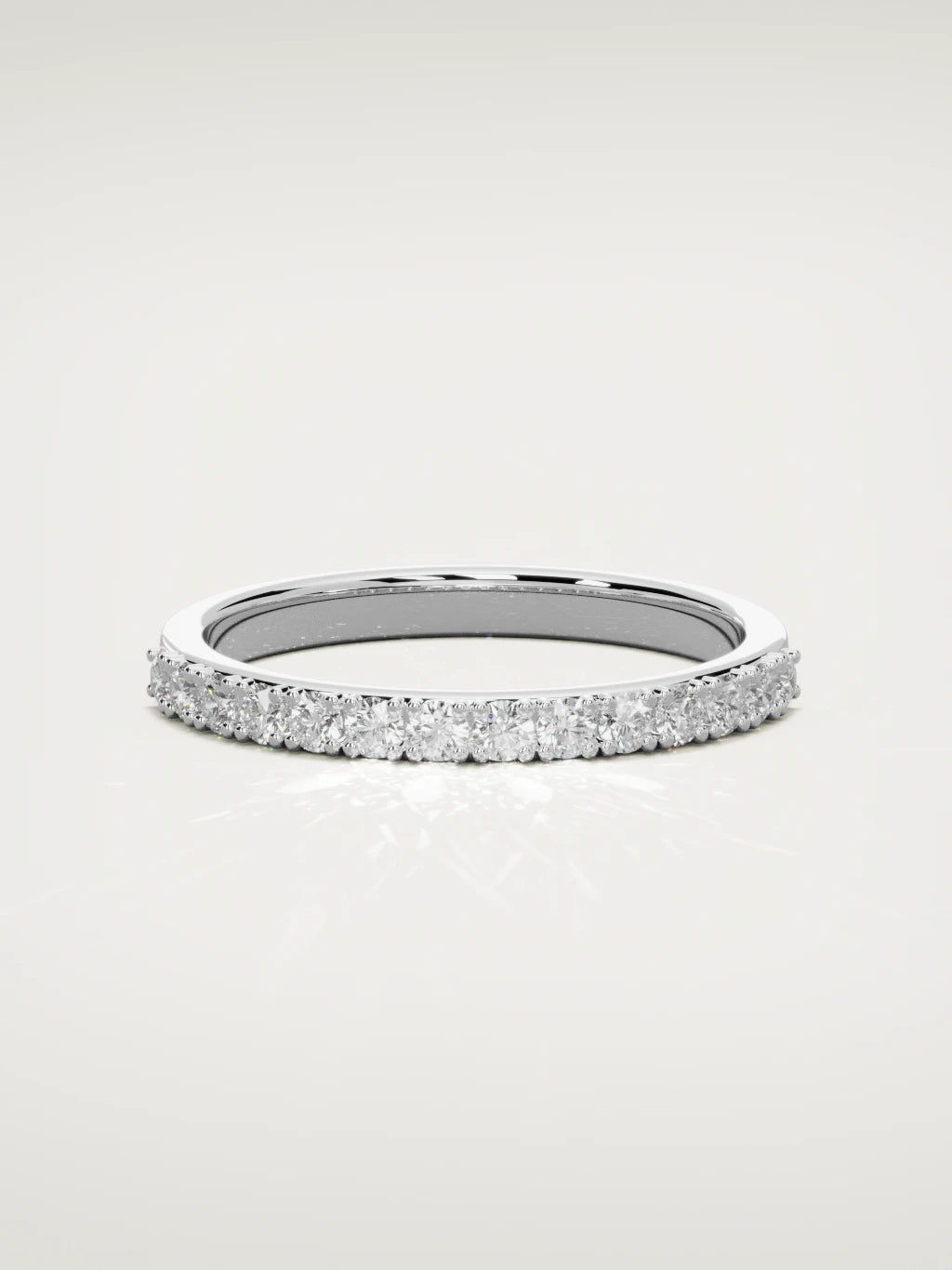 The Sutil low-profile petite half eternity band in 14K white gold, front view
