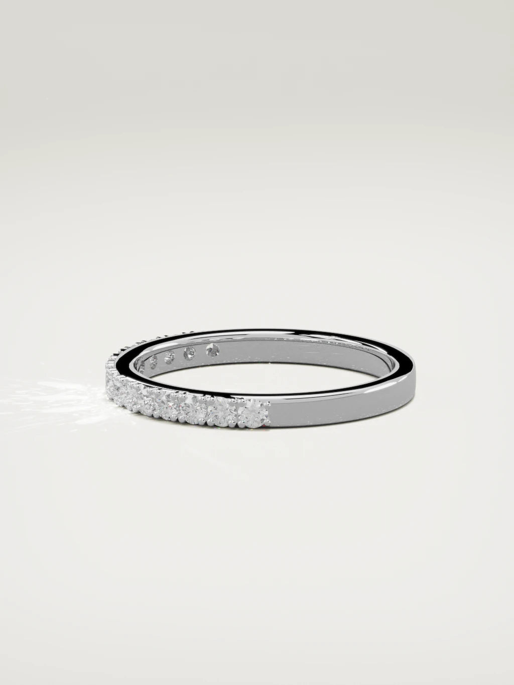 The Sutil low-profile petite half eternity band in 14K white gold, side view