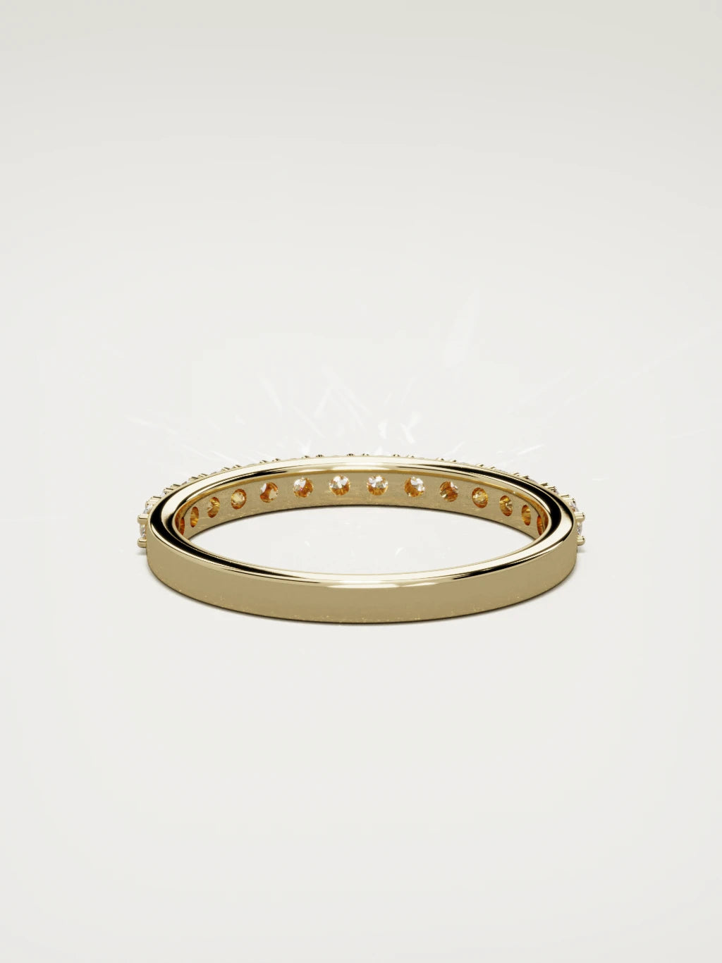 The Sutil low-profile petite half eternity band in 14K yellow gold, back view