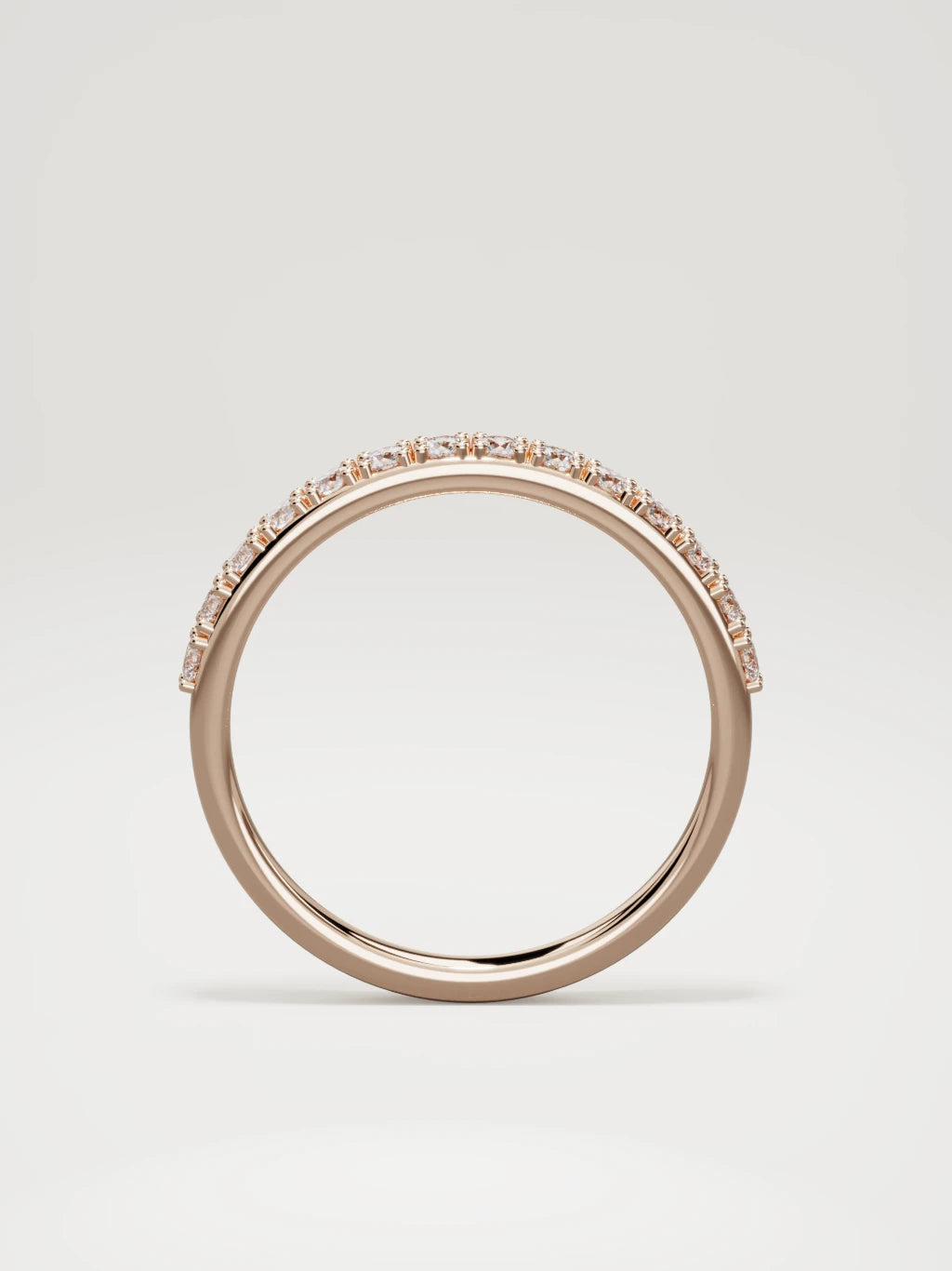 The Sutil low-profile petite half eternity band in 14K rose gold, standing front view