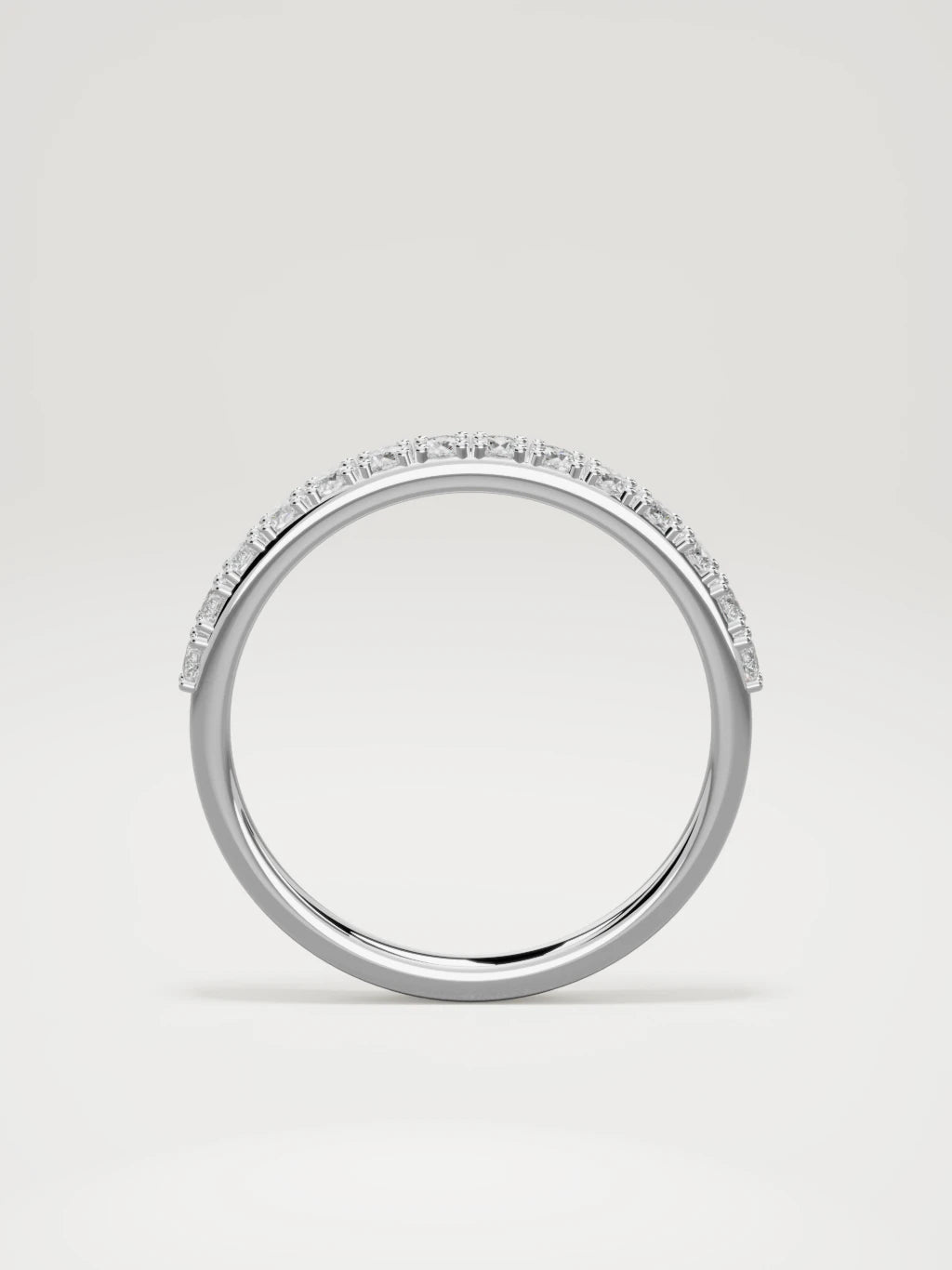 The Sutil low-profile petite half eternity band in 14K white gold, standing front view