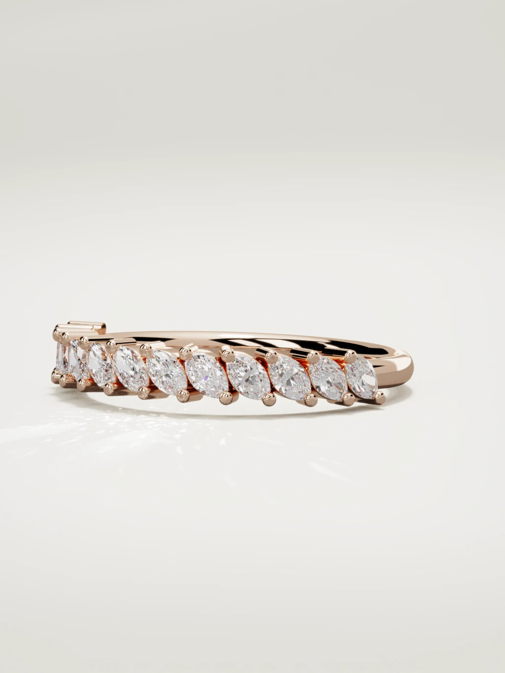 The Union marquise half eternity band in 14K rose gold, three-quarter view