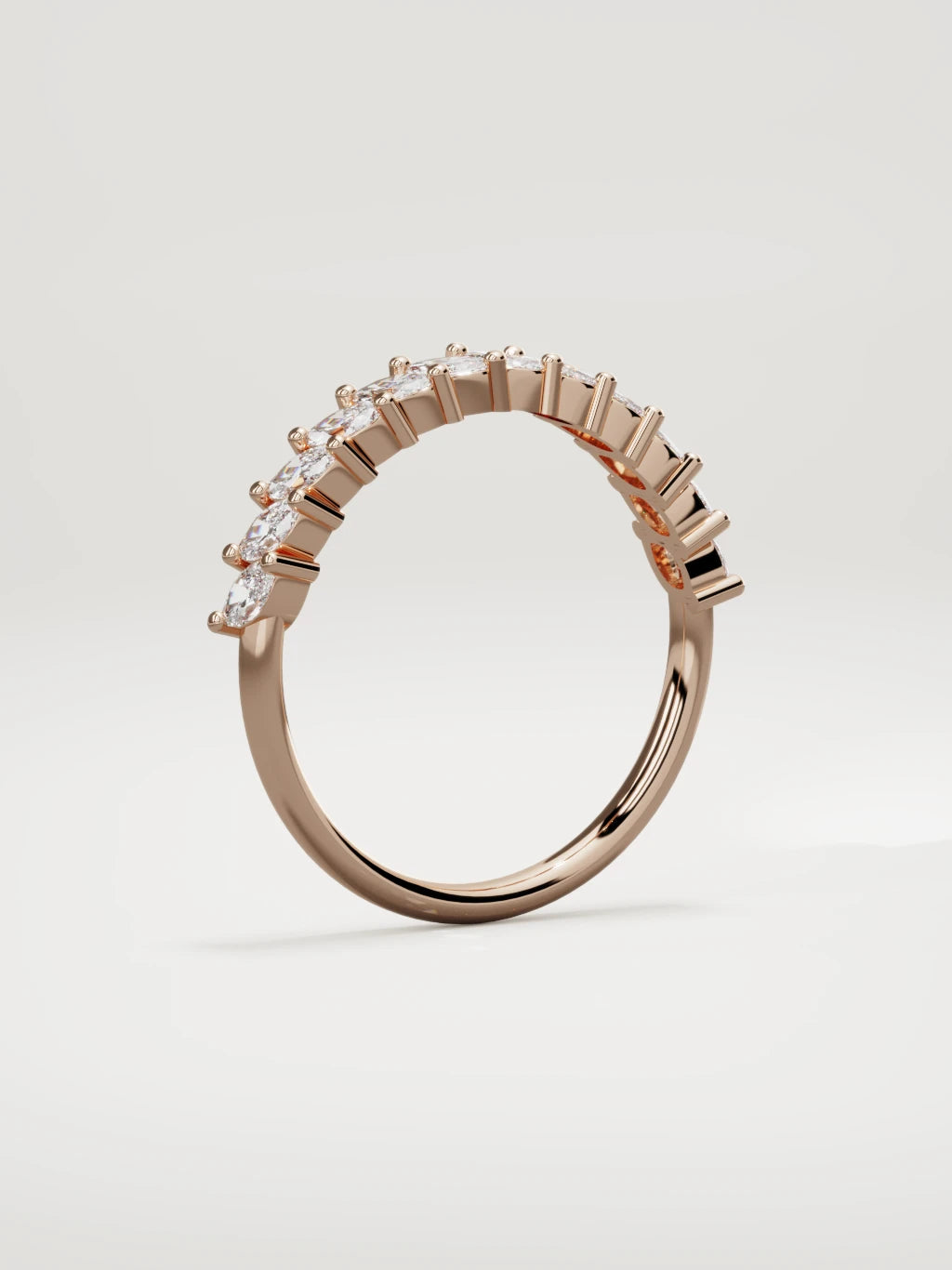 The Union marquise half eternity band in 14K rose gold, standing three-quarter view