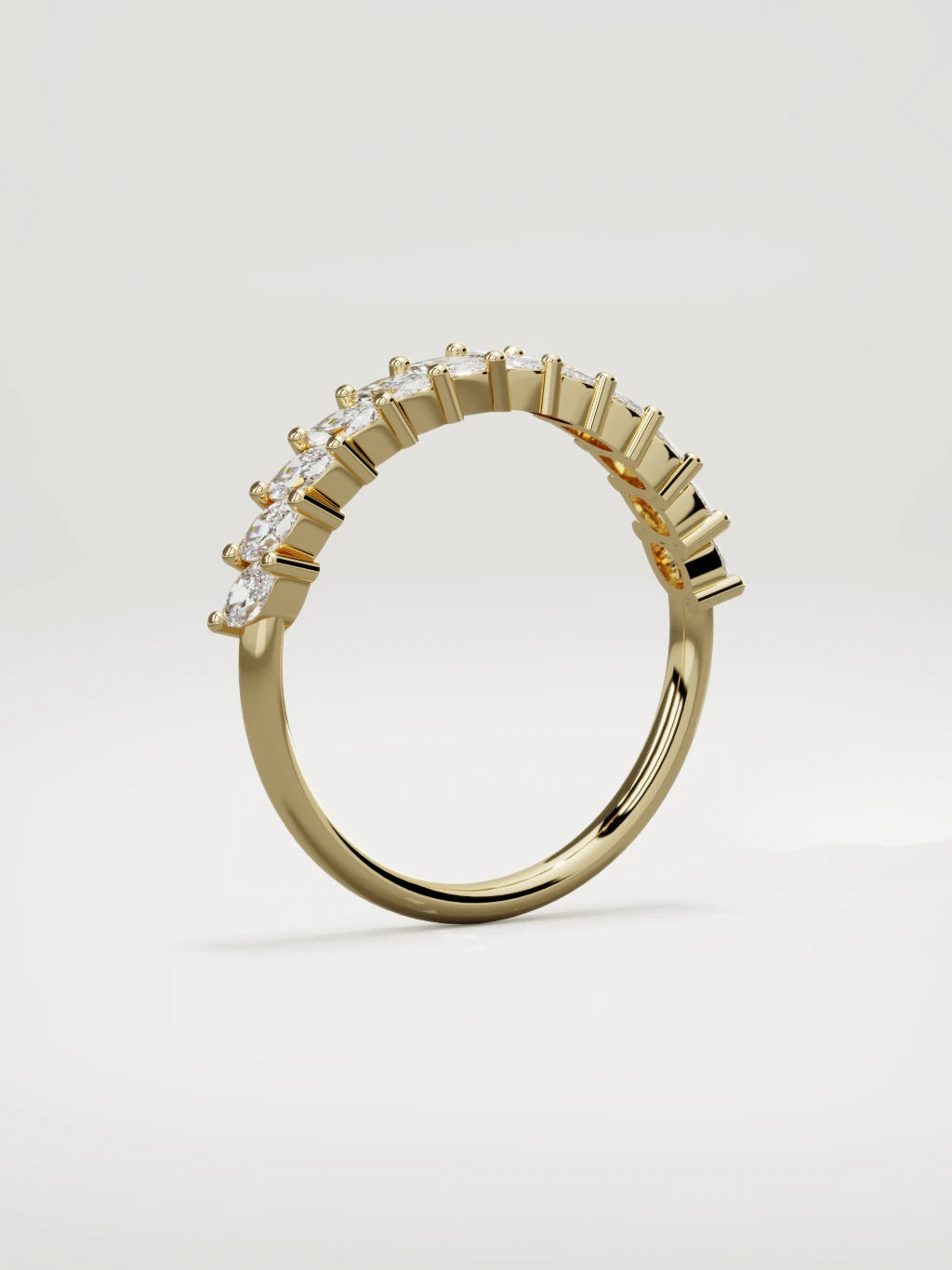 The Union marquise half eternity band in 14K yellow gold, standing three-quarter view
