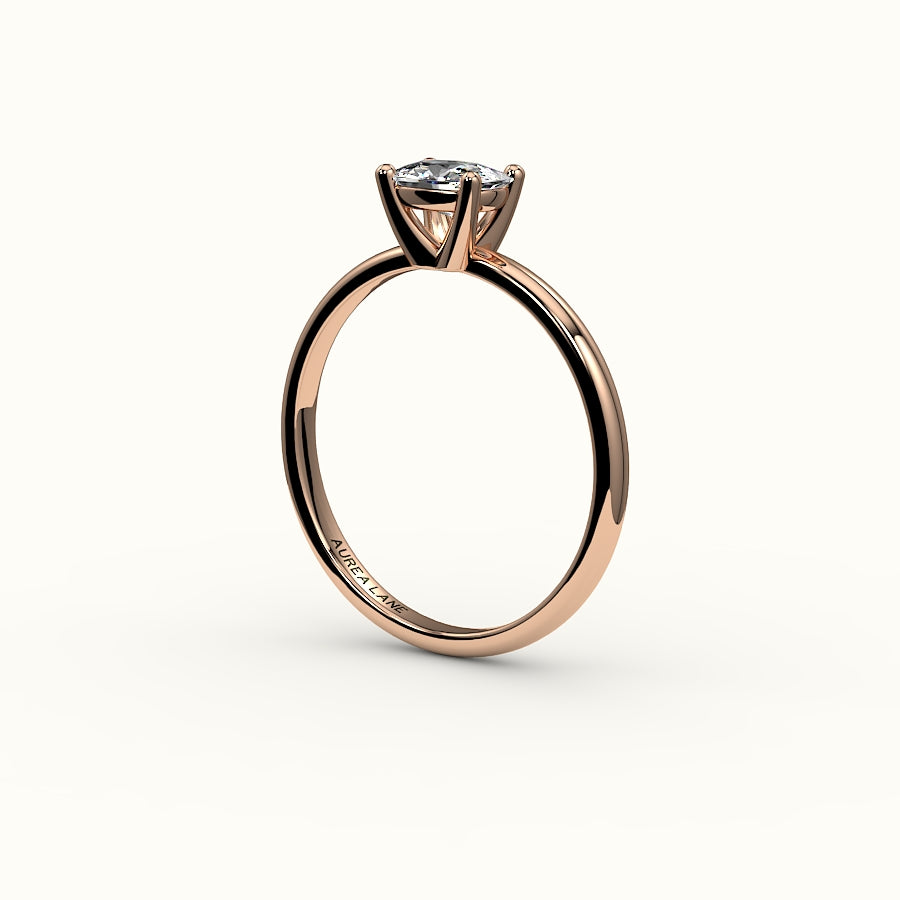 Anillo solitario con engaste de cojín alargado este-oeste