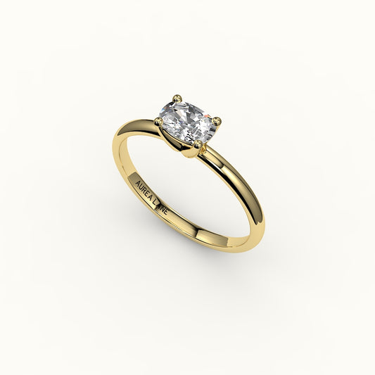 Anillo solitario con engaste de cojín alargado este-oeste