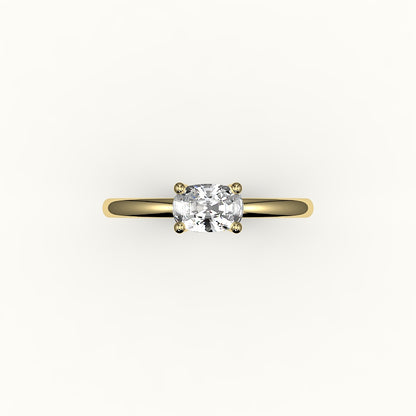 Anillo solitario con engaste de cojín alargado este-oeste