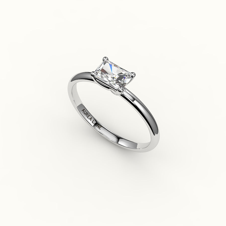 Engaste de anillo solitario de corte radiante este-oeste