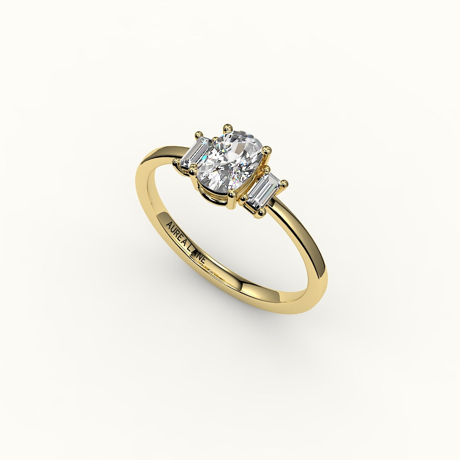 Engaste de tres piedras de corte cojín alargado con baguettes verticales