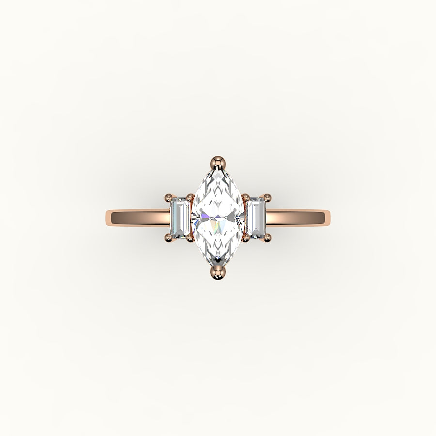 Engaste de tres piedras con talla marquesa y baguettes verticales