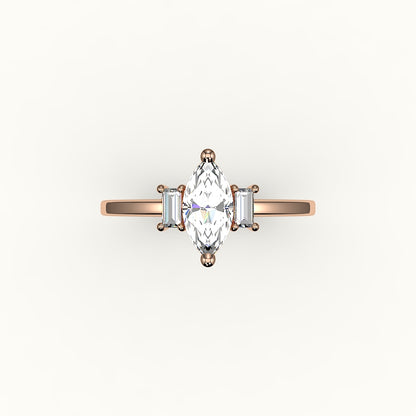 Engaste de tres piedras con talla marquesa y baguettes verticales
