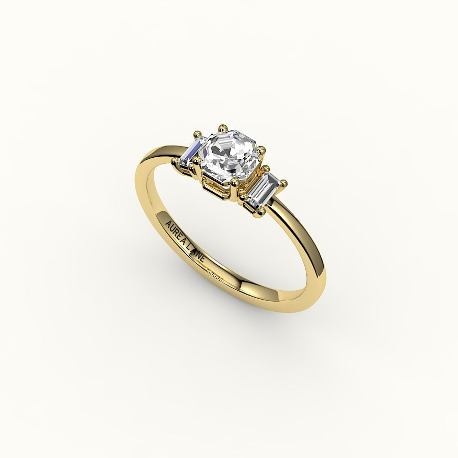 Engaste de tres piedras con corte octogonal y baguettes verticales