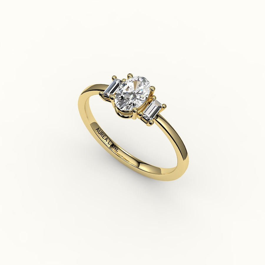 Engaste de tres piedras de corte ovalado con baguettes verticales