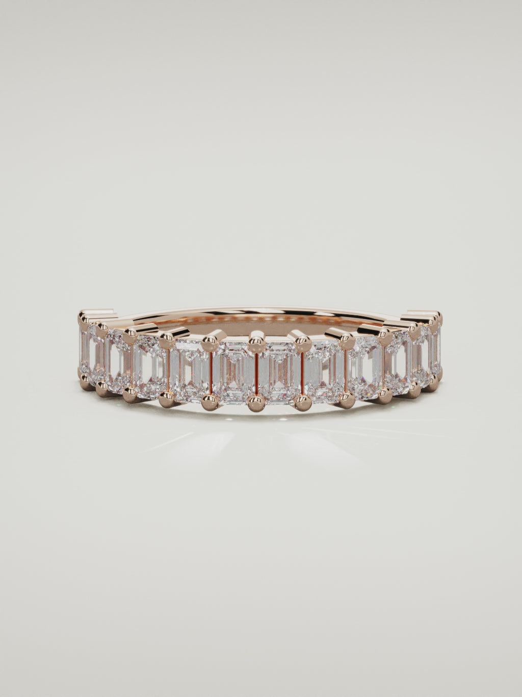 The Gracia prong emerald-cut half eternity band in 14K rose gold, 360 turntable video