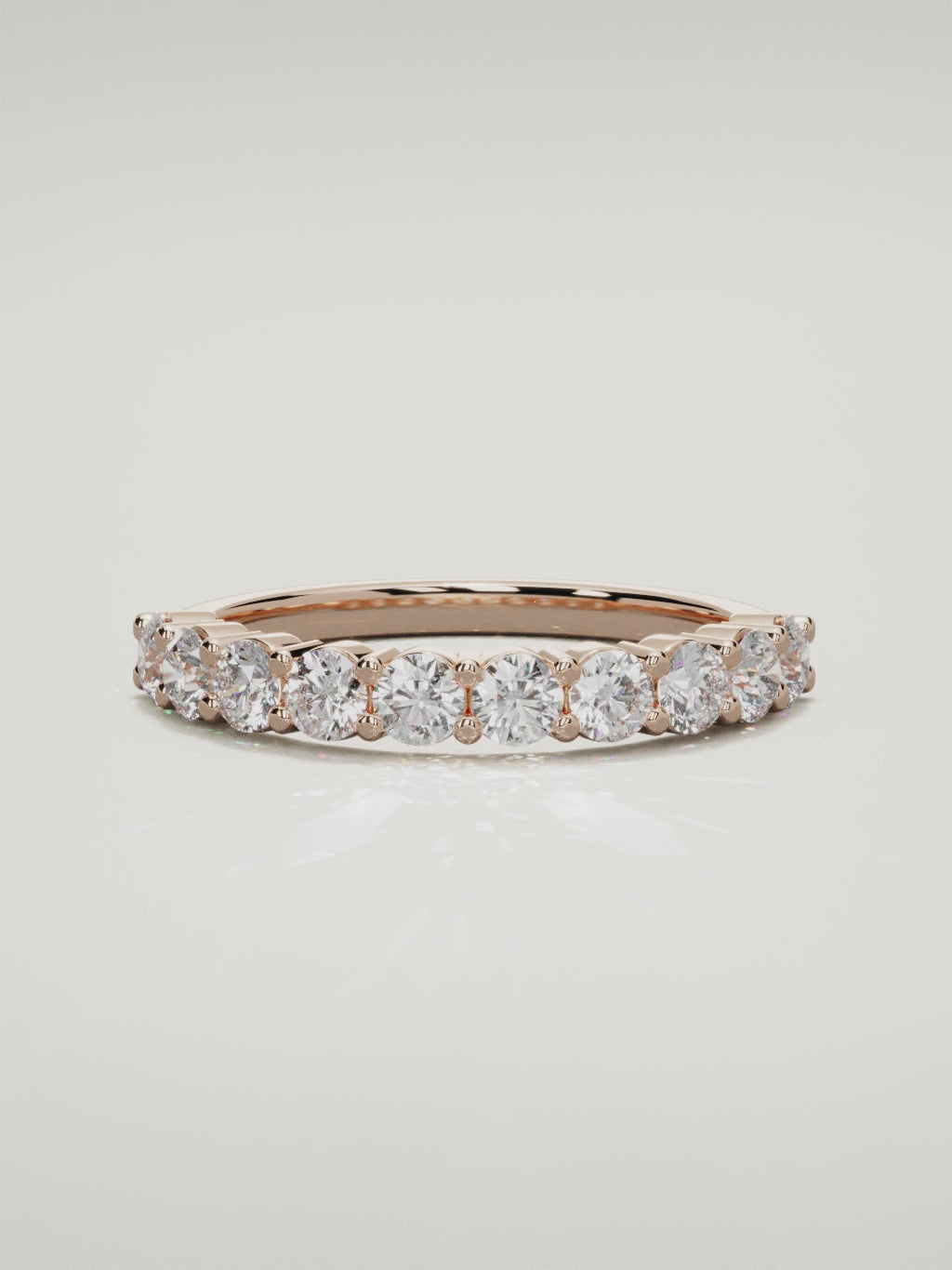 The Clara shared-prong half eternity band in 14K rose gold, 360 turntable video