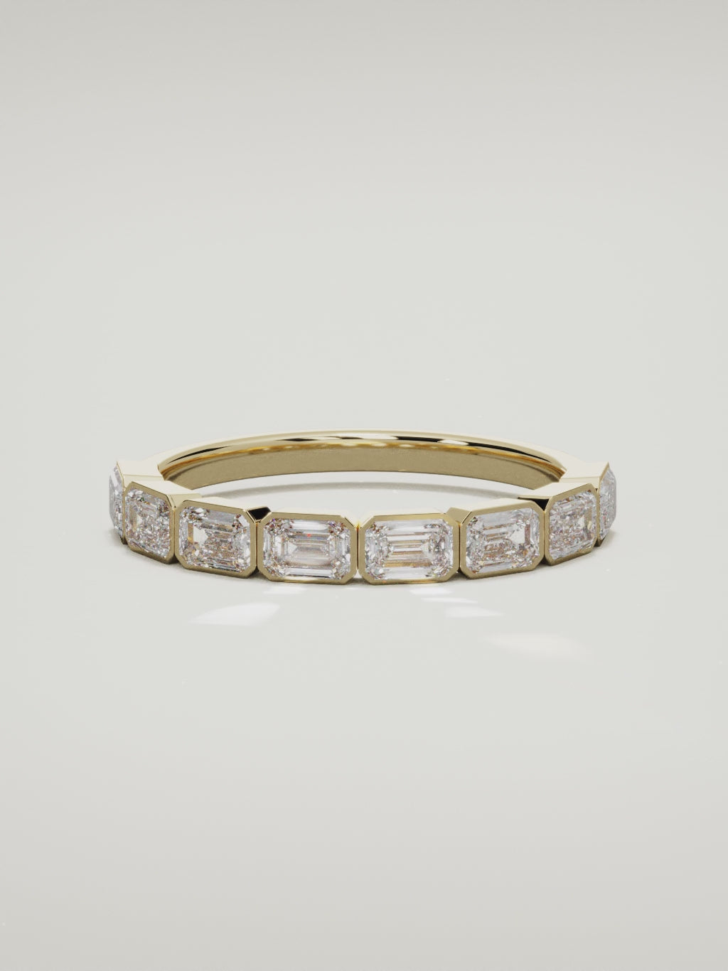 The Cristal east-west bezel emerald-cut band in 14K yellow gold, 360 turntable video