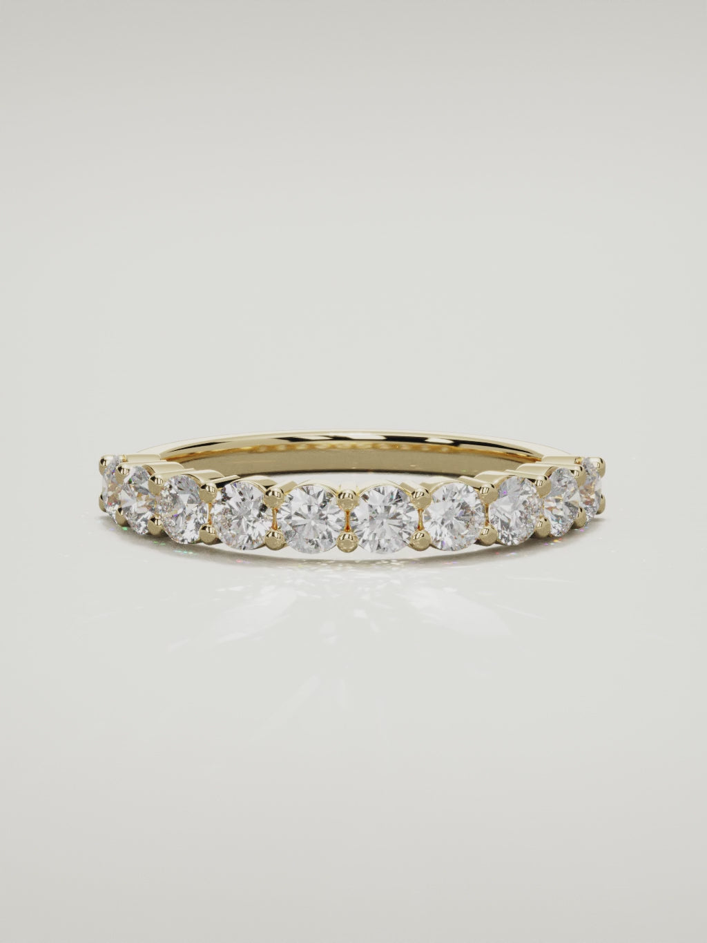 The Clara shared-prong half eternity band in 14K yellow gold, 360 turntable video