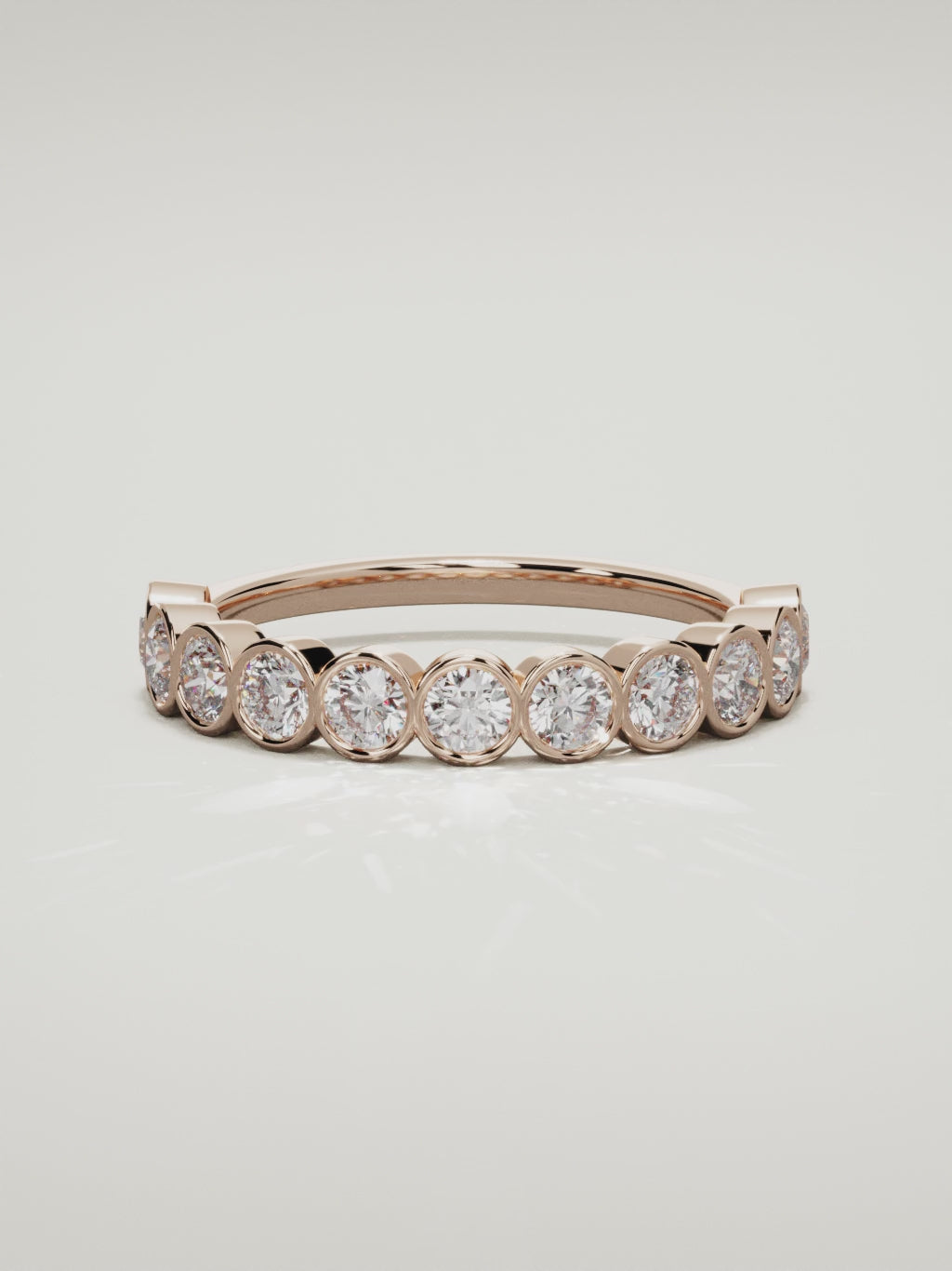 The Perla bezel bubble half eternity band in 14K rose gold, 360 turntable video