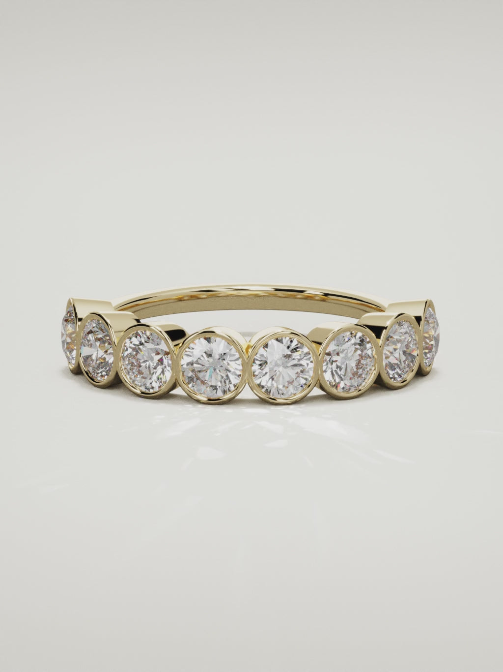 The Lumen large bezel bubble half eternity band in 14K yellow gold, 360 turntable video