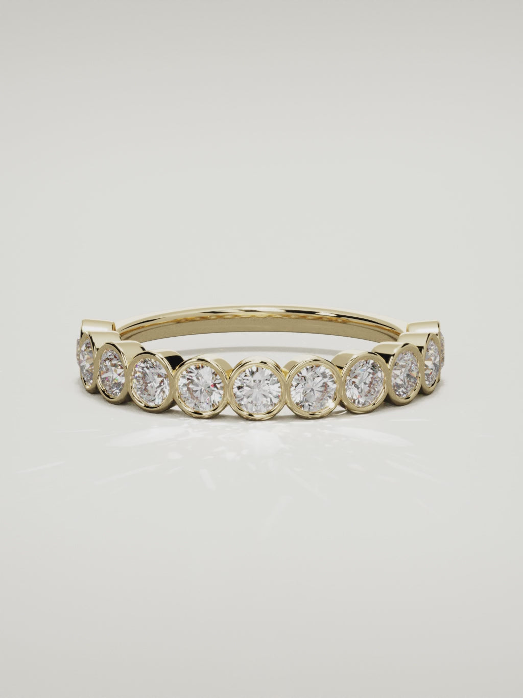 The Perla bezel bubble half eternity band in 14K yellow gold, 360 turntable video