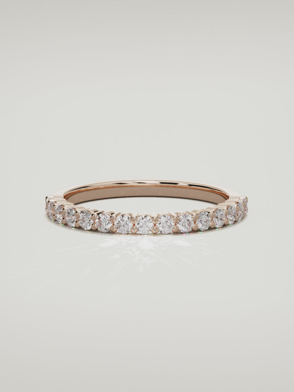 The Danza petite shared-prong half eternity band in 14K rose gold, 360 turntable video