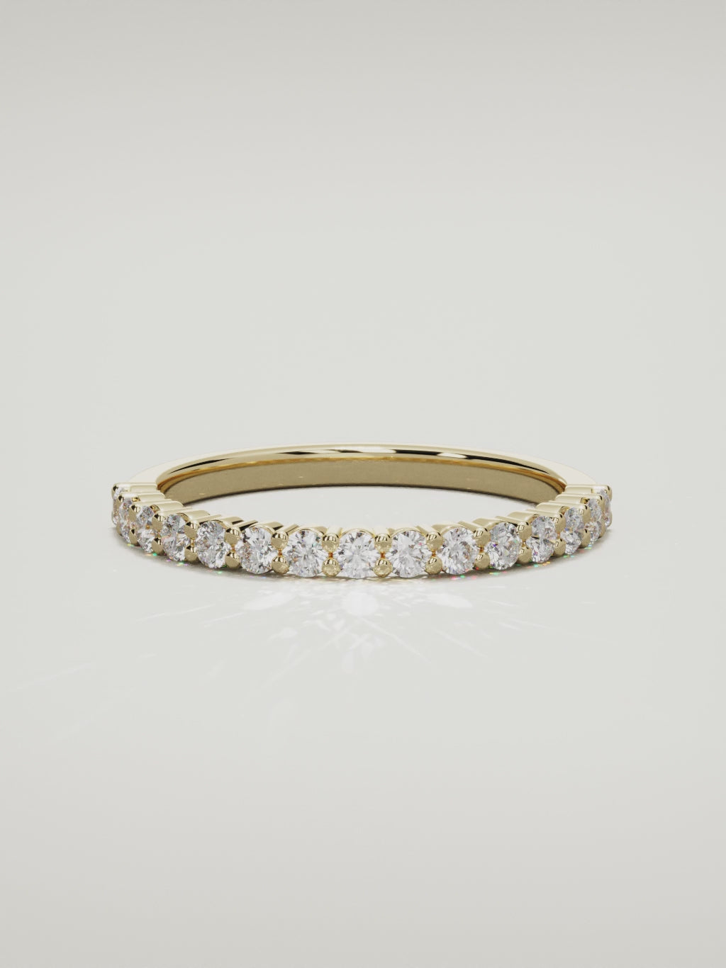 The Danza petite shared-prong half eternity band in 14K yellow gold, 360 turntable video