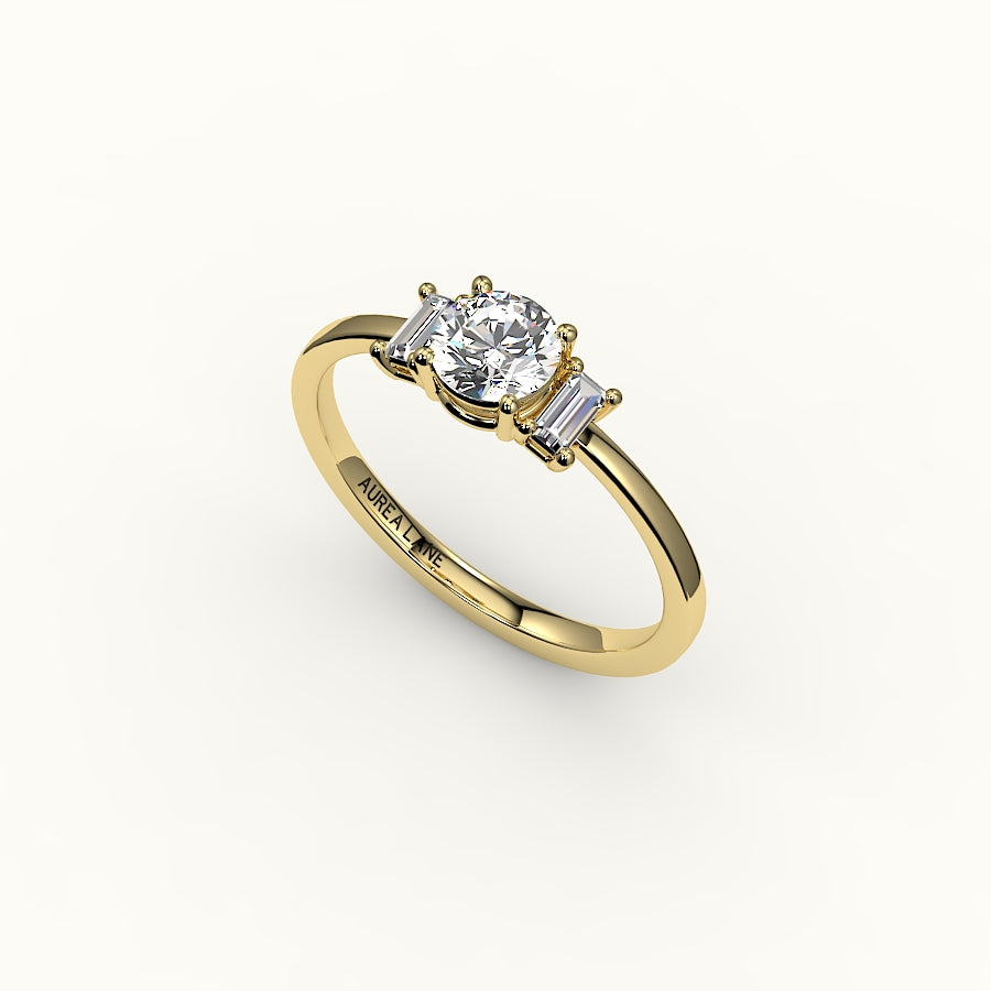 Engaste de tres piedras de corte redondo con baguettes verticales