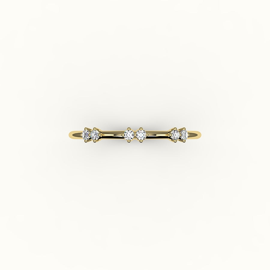 Banda de diamantes redondos salteados